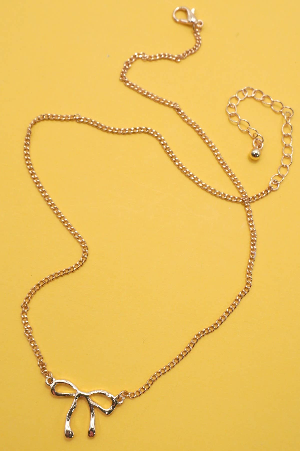 CLASSIC HAMMERED BOW NECKLACE | 31N50532